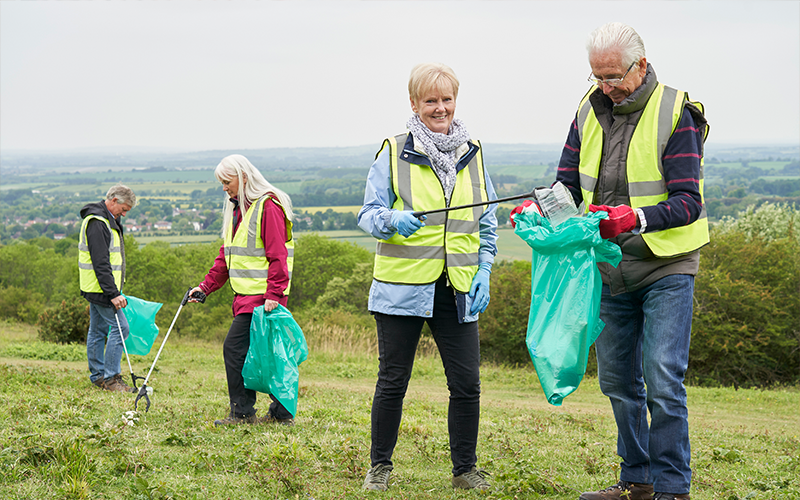 seniors volunteering to clean up a park