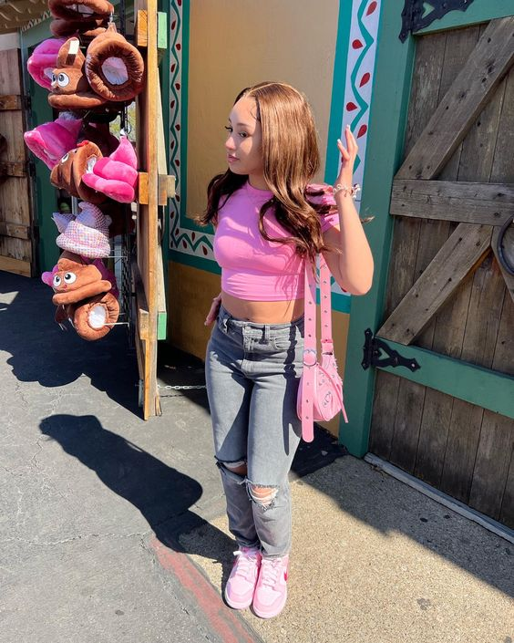 Another girl with jean and top shows off the triple pink dunk look