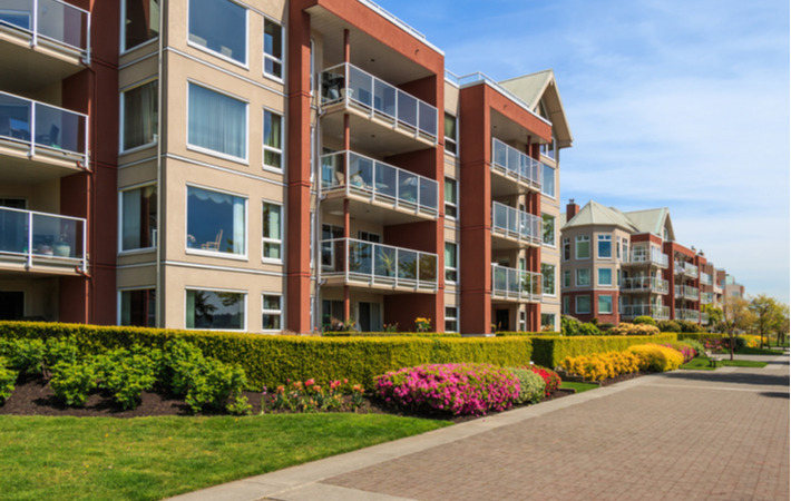 a photo of a condo building on a sunny day