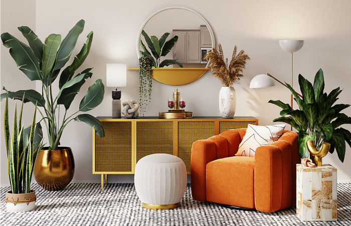 A living room decorated with a combination of au-natural and modern artisan decor and furniture. A mid-century modern cabinet is paired with an orange velvet chair and an elegant white pouf. A variety of house plants in metallic and ceramic planters also decorate the space. 