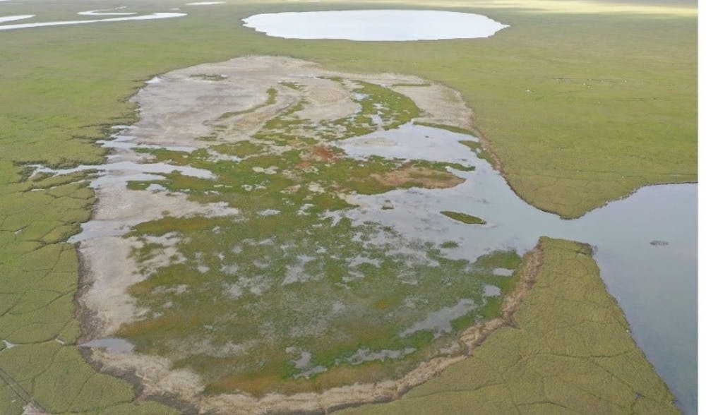 Image of lake drained by permafrost melt.