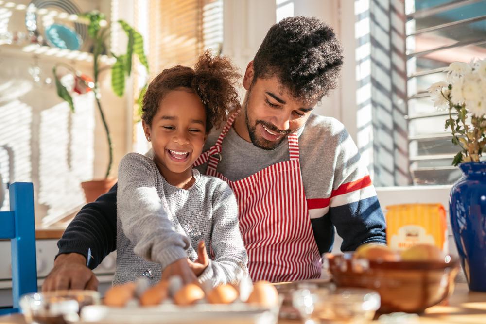 ../../Desktop/stock-photo-african-american-father-and-daughter-cooking-in-the-kitchen-dad-is-wearing-an-apron-they-are-both-605521802.jpg