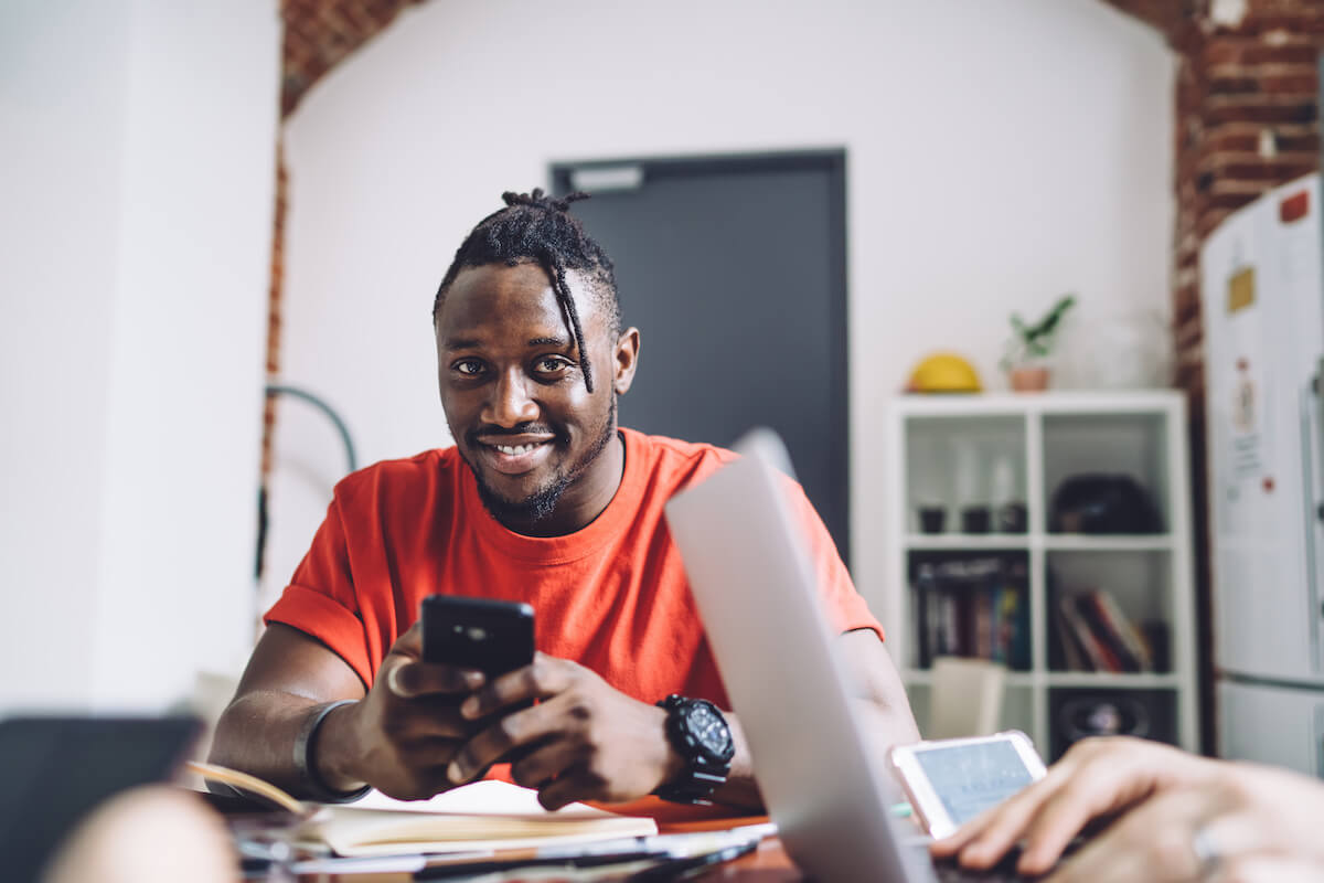 Digital patient engagement tools: happy man using his phone