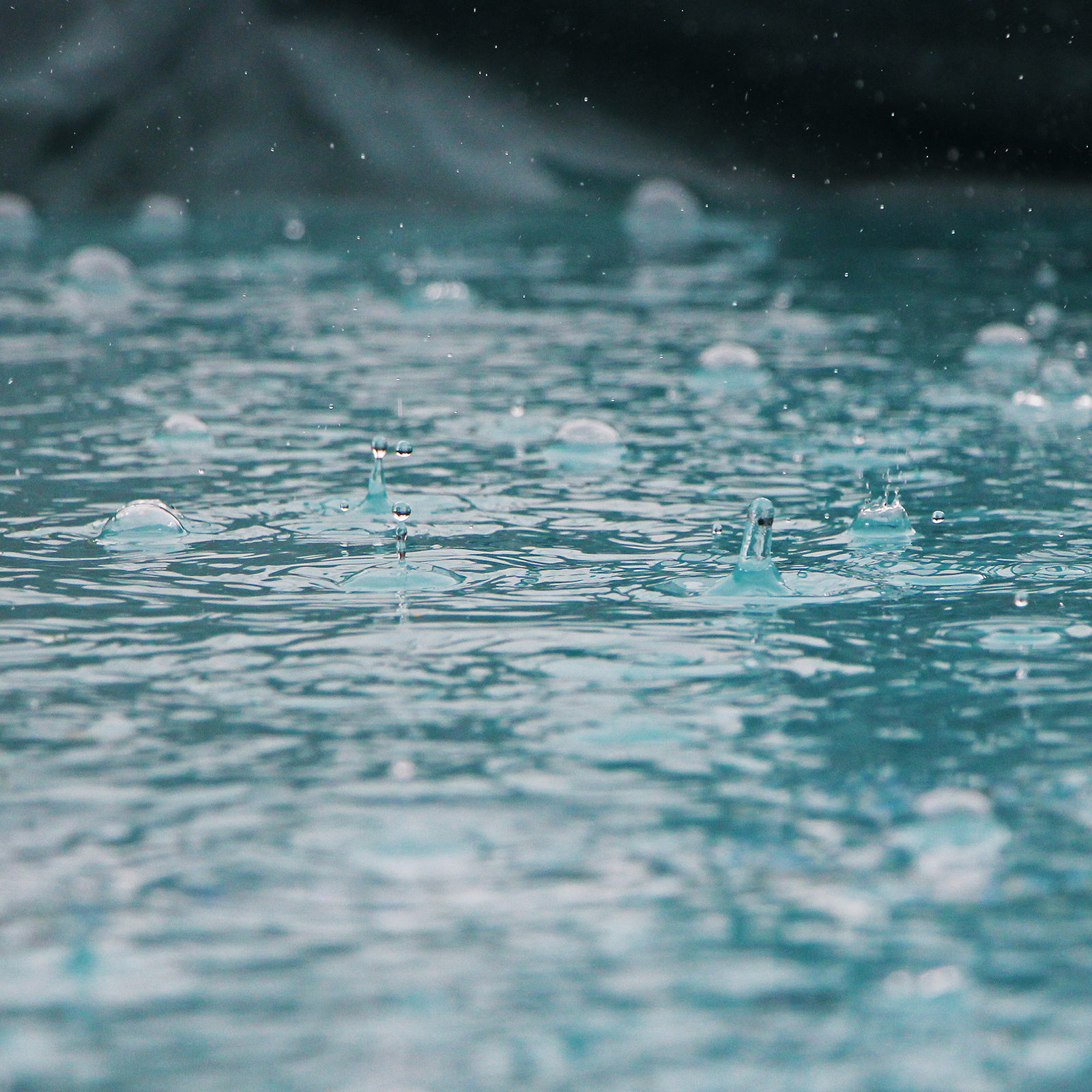 rain falling in pool water