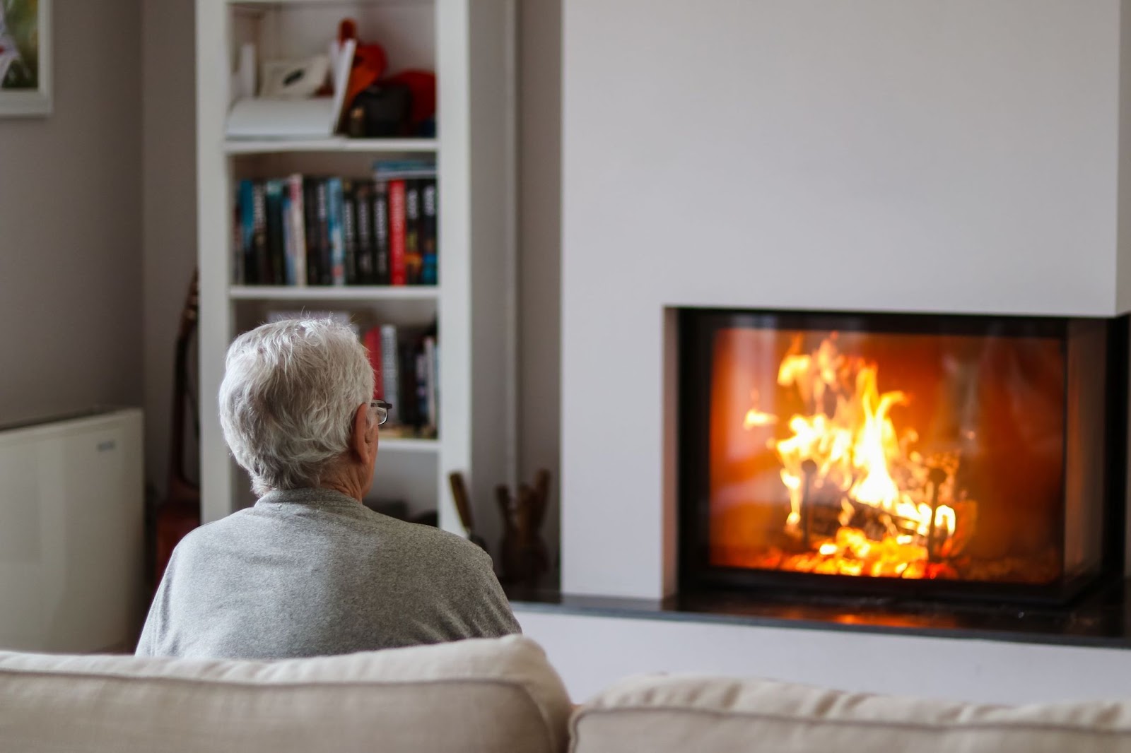 older-man-resting-by-the-fireplace