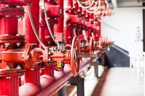 Fire fighter's water pipeline system A row of red color fire fighting water supply pipeline system safety valves stock pictures, royalty-free photos & images