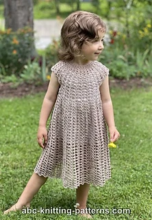 little girl wearing a flowy long crochet dress