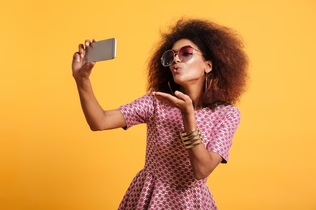 Pretty Young Girl Taking Selfie With Flying Kiss