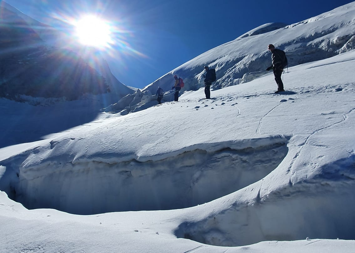 Climbers nearing the summit of Mont Blanc on a sunny day
