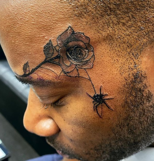 Hanging Spider From Flower Tattoo