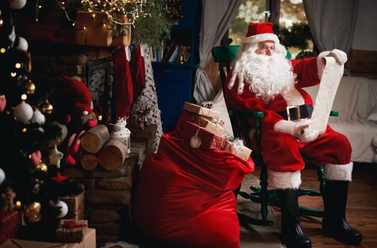 man dressed as Santa in a cozy living room decked out in holiday decor