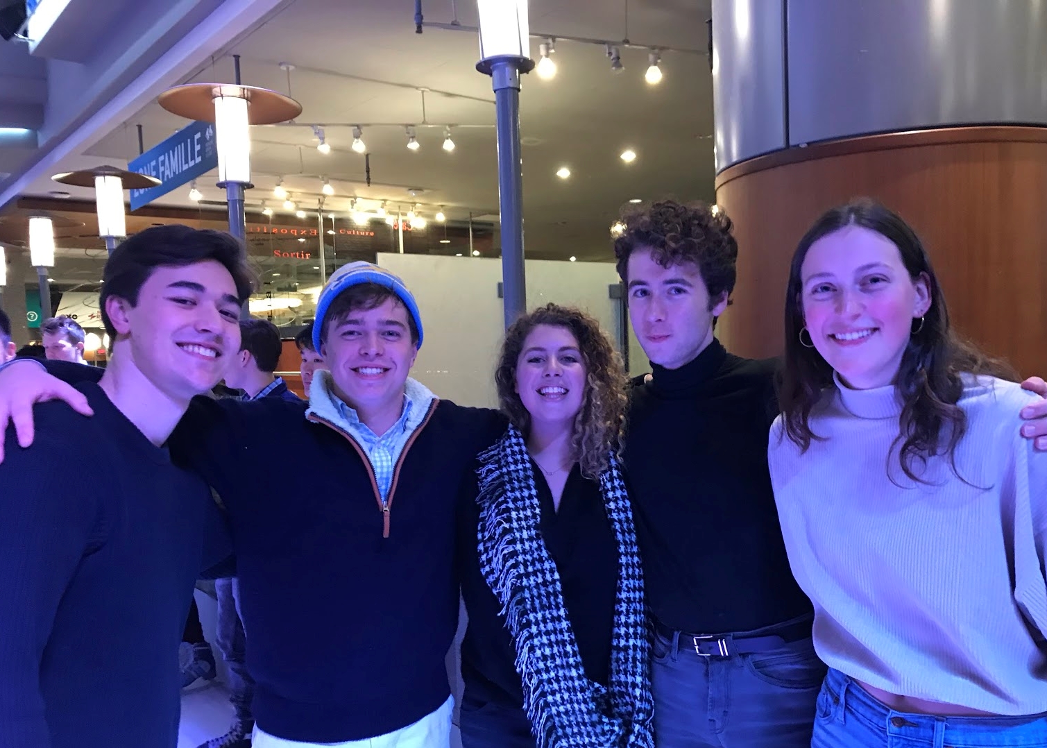 Lucy (right) with Will, Nick, Lena, and Zev in Montreal on our 2019 winter tour—everything’s blue from the light in the skating rink!!