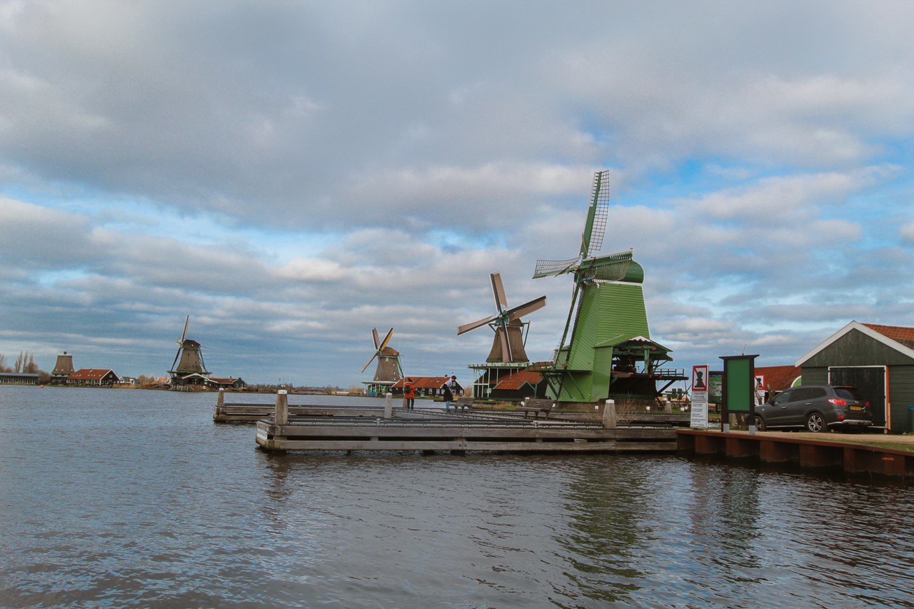 Colourful De Zaanse Schans windmills painted across the dam