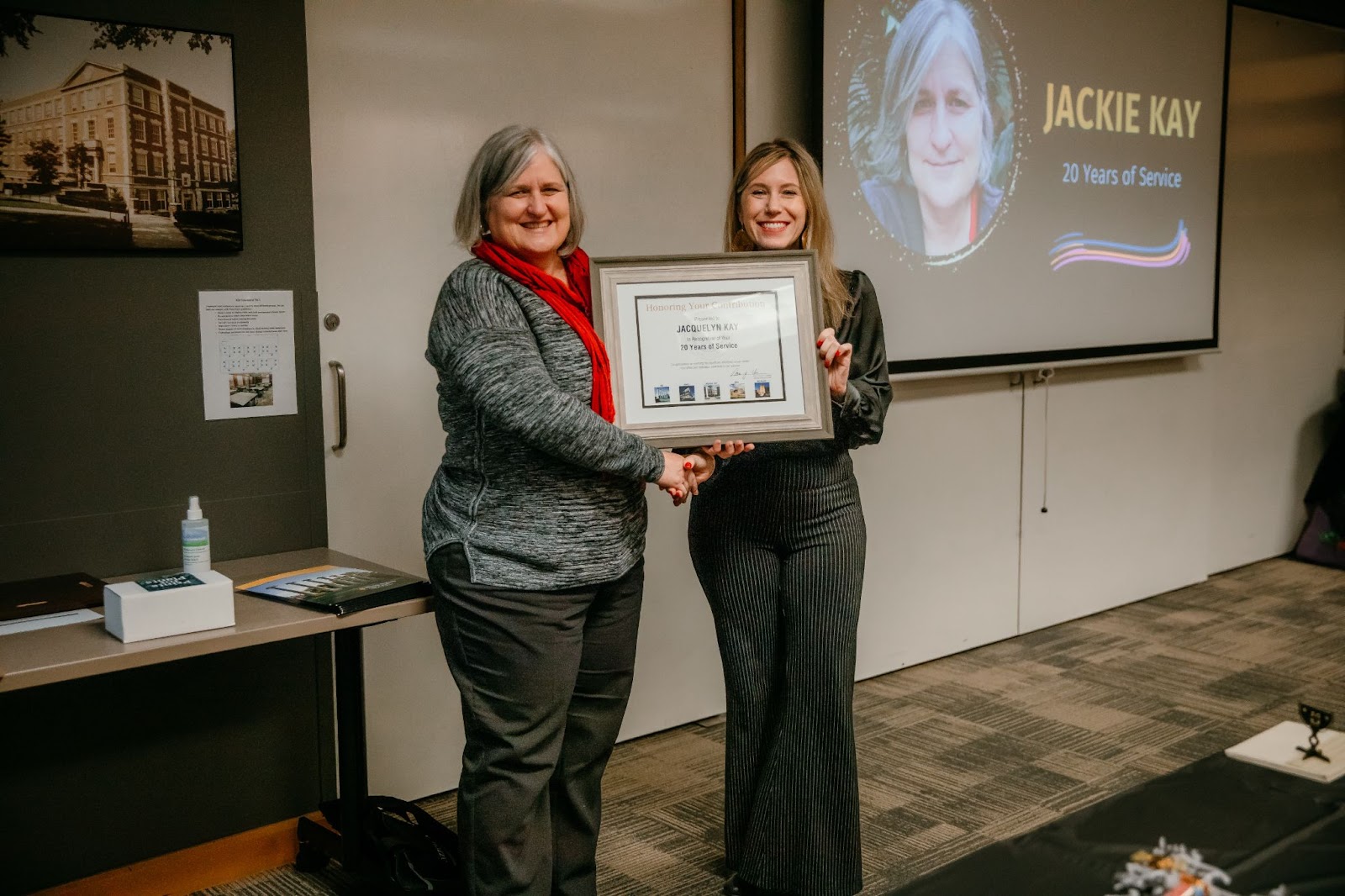 Jacquelyn Kay receiving award from Dr. Fishman-Weaver