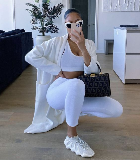 lady wearing all-white chic fashion style with white sneakers