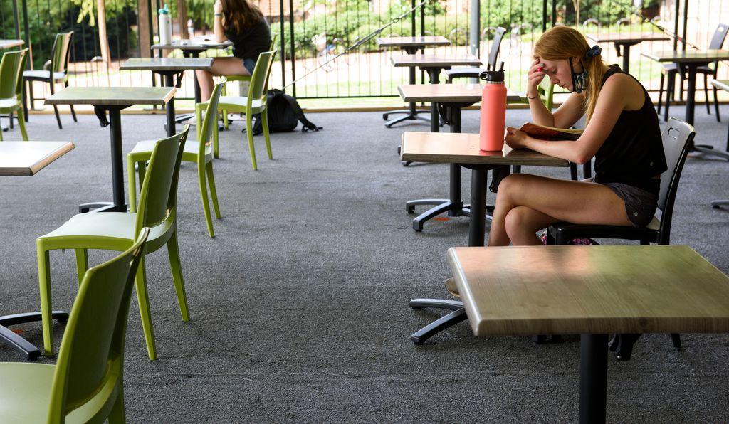A student studies in an open-air seating area on the campus of the University of North Carolina at Chapel Hill on August 18, 2020 in Chapel Hill, North Carolina.