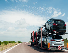 A double-decker car transport truck