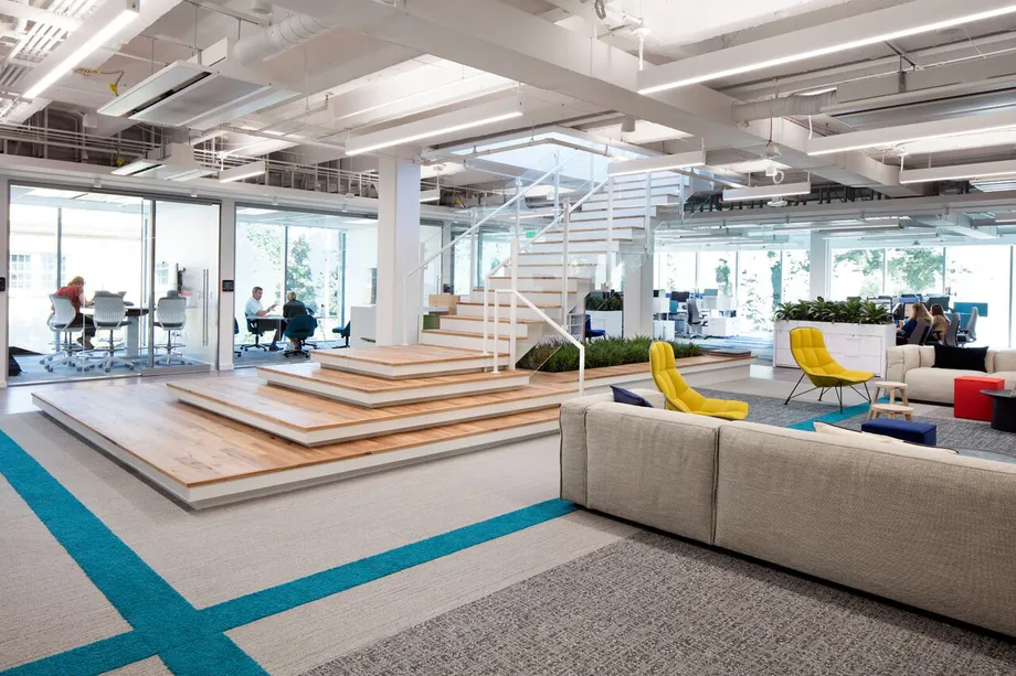 Expansive common spaces in Interface HQ in Atlanta with welcoming pops of color