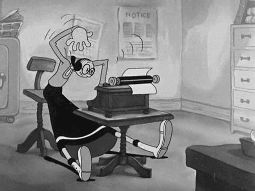 a woman types furiously as she types a script
