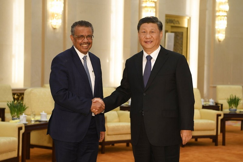 China's Xi Jinping (right) with WHO chief Tedros 
