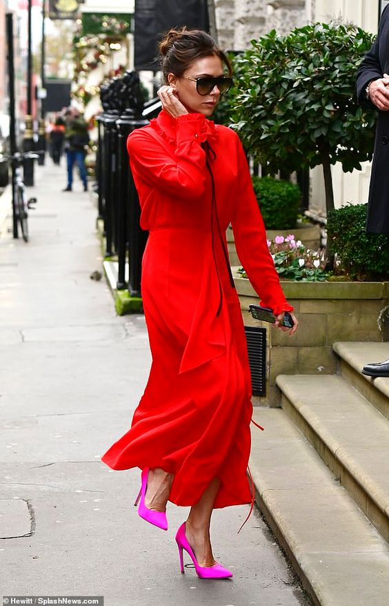 lady wearing red long gown with pink shoes