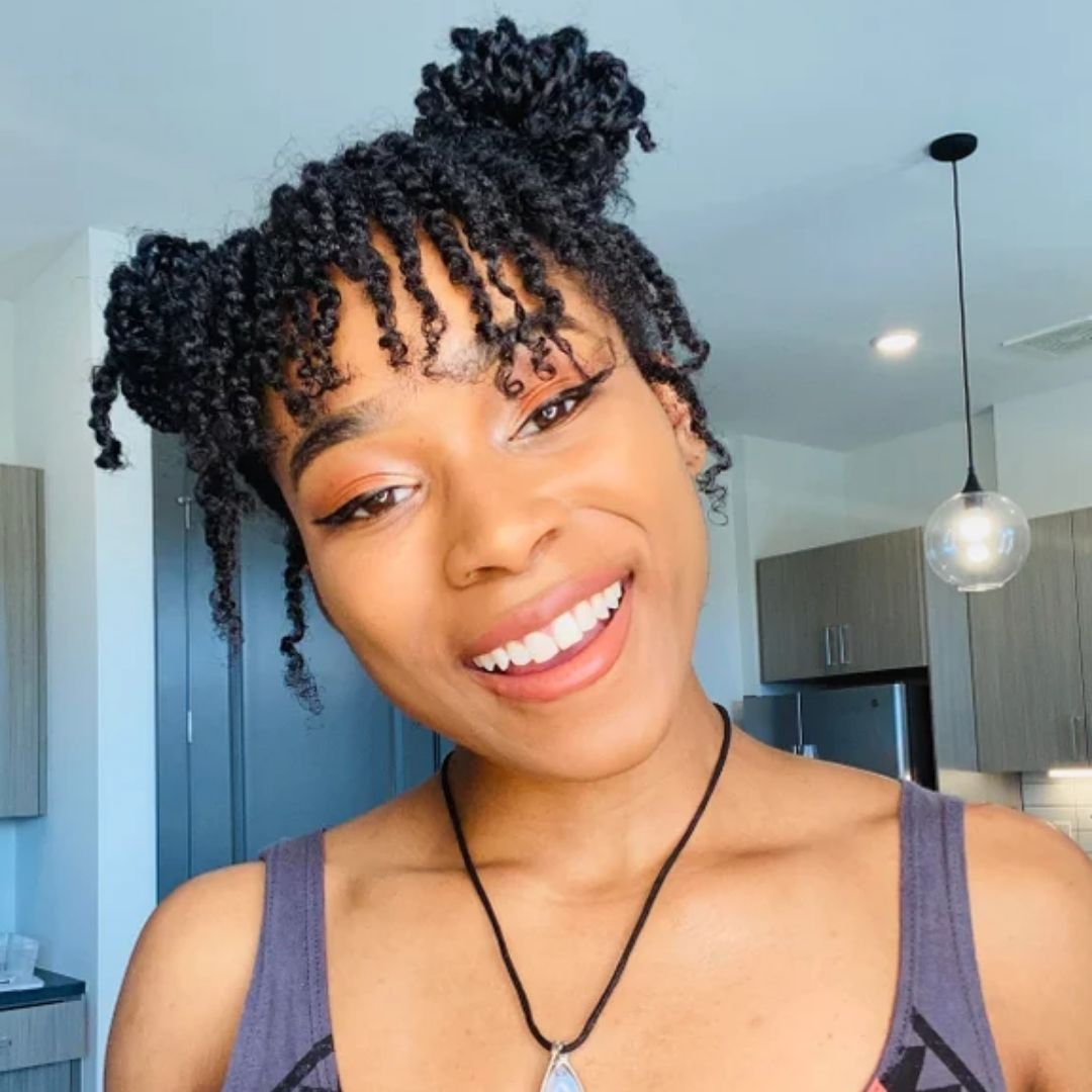 Young lady wearing two-strand twists.
