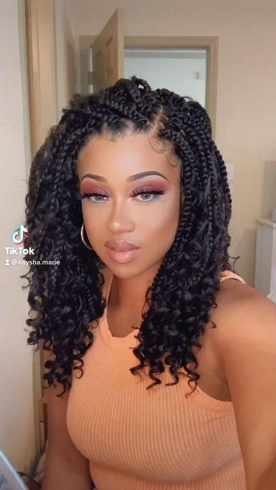 lady wearing short braids with curls