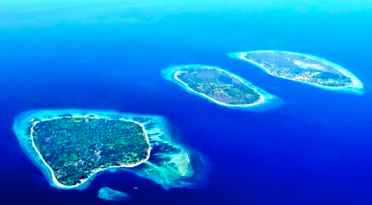 Image of three islands in a blue ocean. 