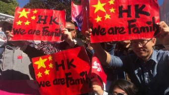 'The patriots held umbrellas for the national flag'