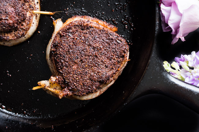 Bacon Wrapped Cacao Crusted Fillet Mignon- this indulgent cut of beef melts like butter in your mouth with a coating of a cacao rub and wrapped in bacon. Treat yourself with this dinner for two on Valentine's Day! 