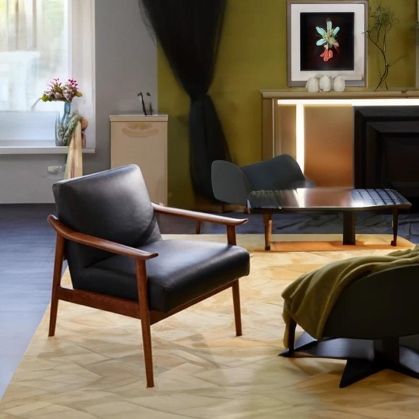 Black accent chair featuring a leatherette seat and backrest: Armed and dangerously cool