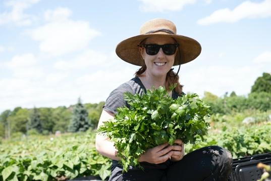 A person sitting in a garden Description automatically generated