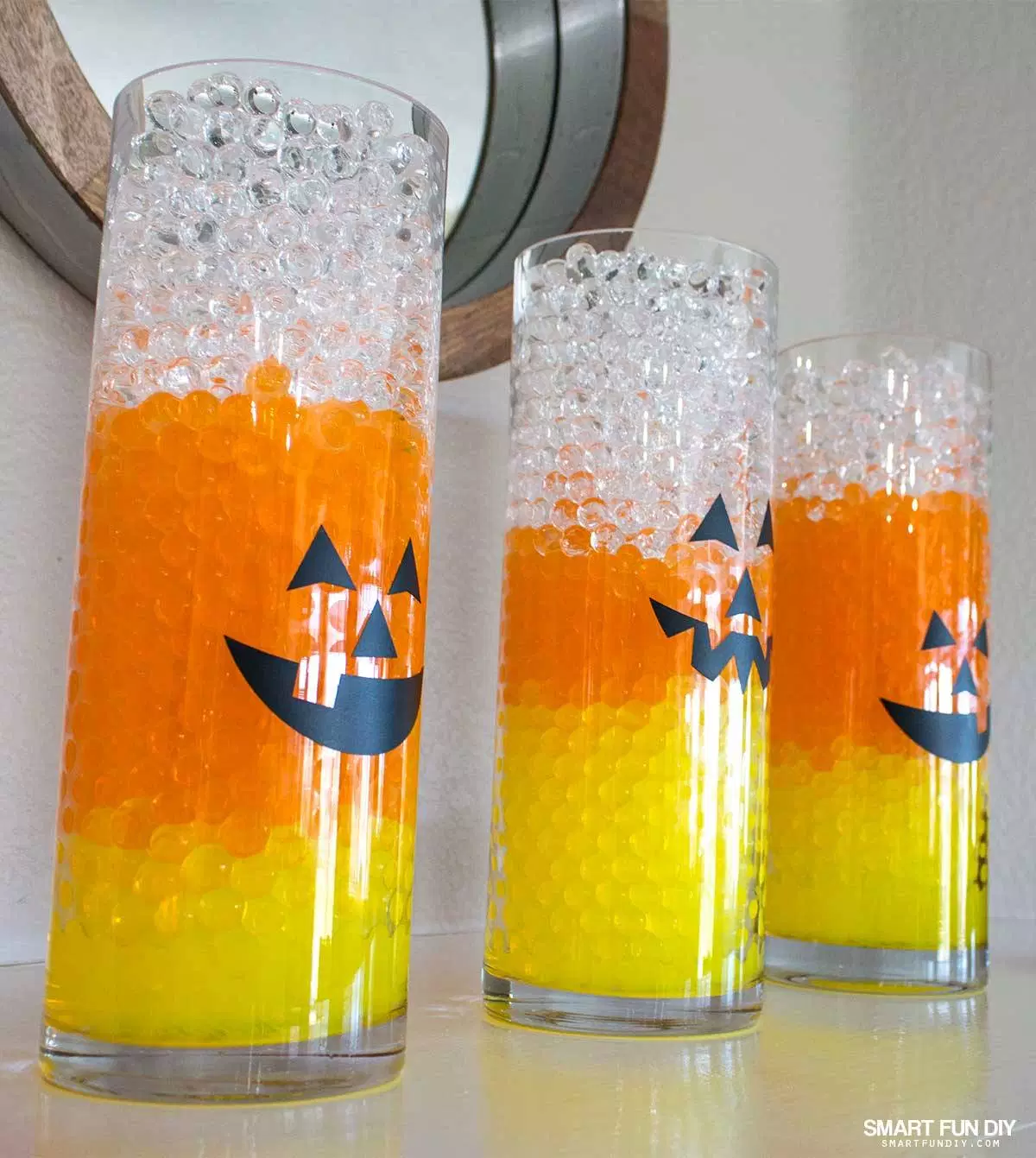 Candy Corn Halloween Vases: These 30 DIY Halloween Decorations That Are Wickedly Creative will save you money and allow your creativity to flourish