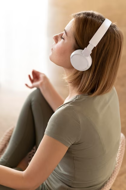 girl meditating with headphones