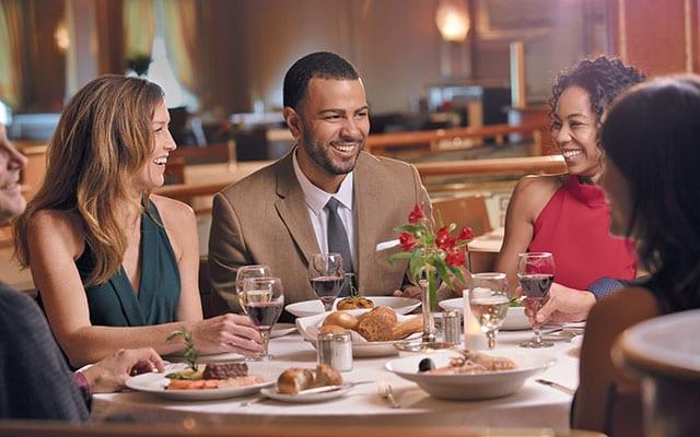 A group of people sitting at a table in a restaurant

Description automatically generated