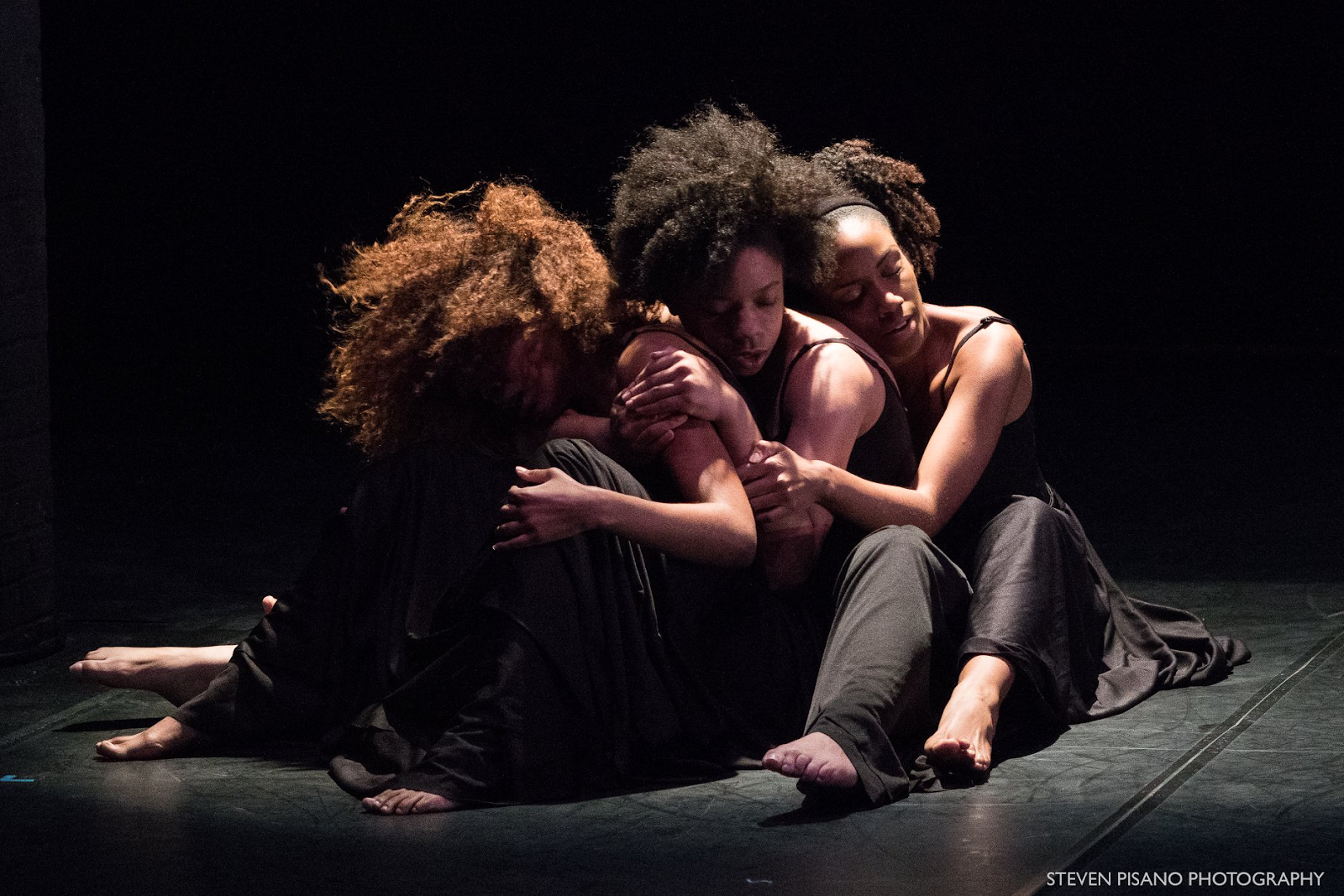 3 black women in a dance performance