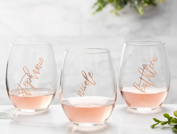 rose-gold personalized wine glasses "stephanie" "nicole" and "kathleen" in cursive font