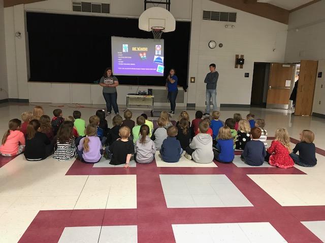 Students seated at assembly for Halloween Safety