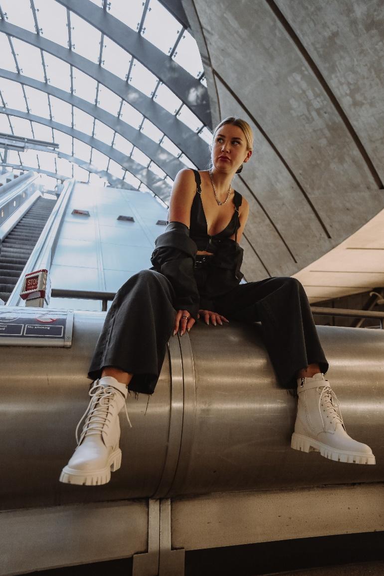 A person sitting on a staircase
Description automatically generated with medium confidence