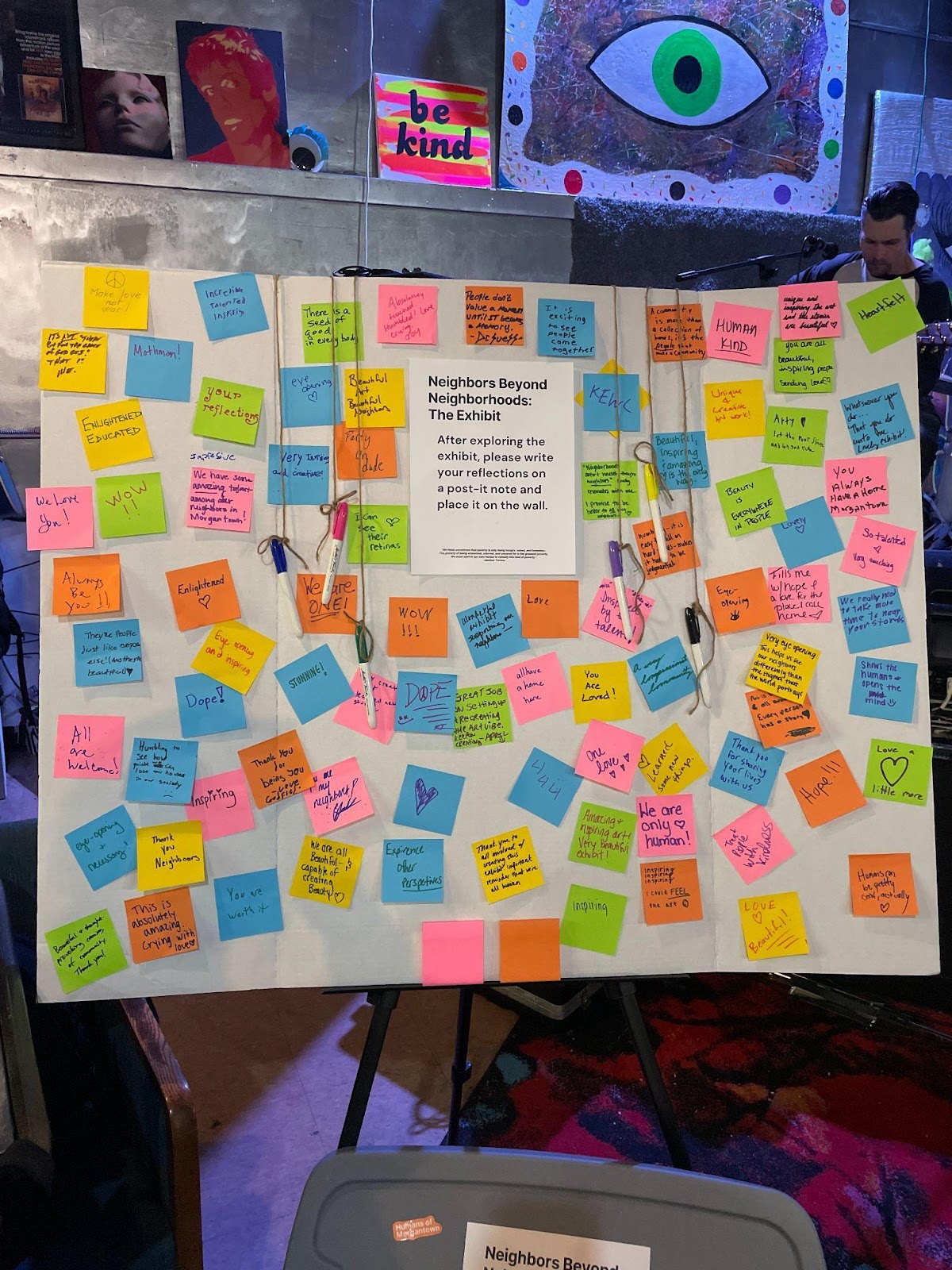 White poster board covered in rainbow sticky notes