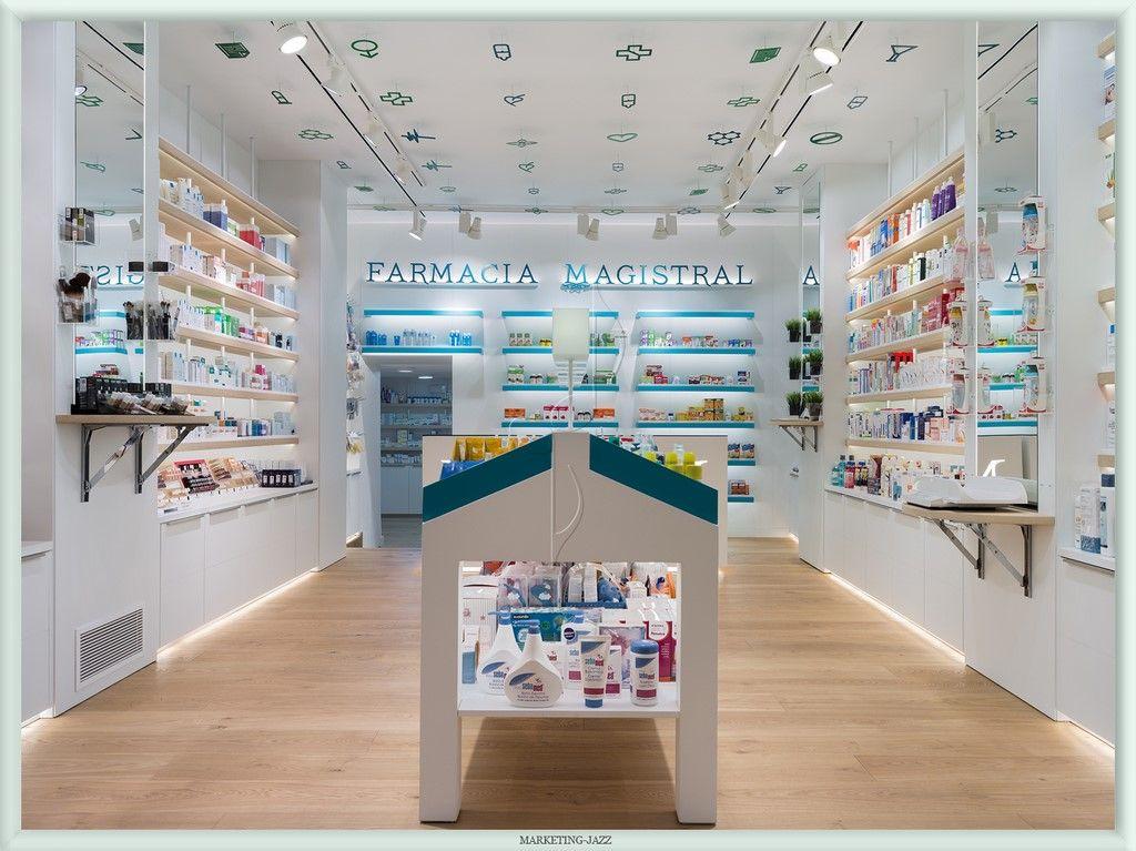 A imagem mostra uma farmácia com pouca disposição de produtos, mas com uma estética clara e bem iluminada.