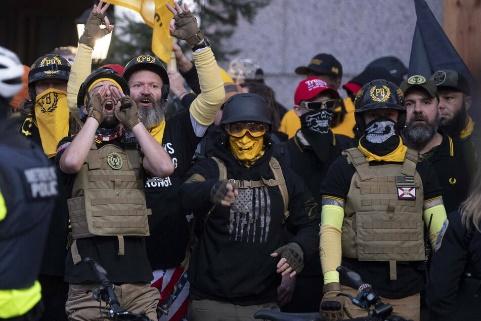 A group of people in riot gear

Description automatically generated with medium confidence