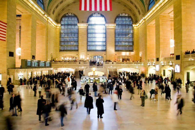 busy travelers in station