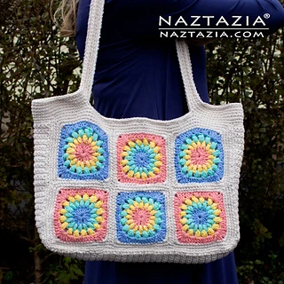 woman carrying a granny square tote bag