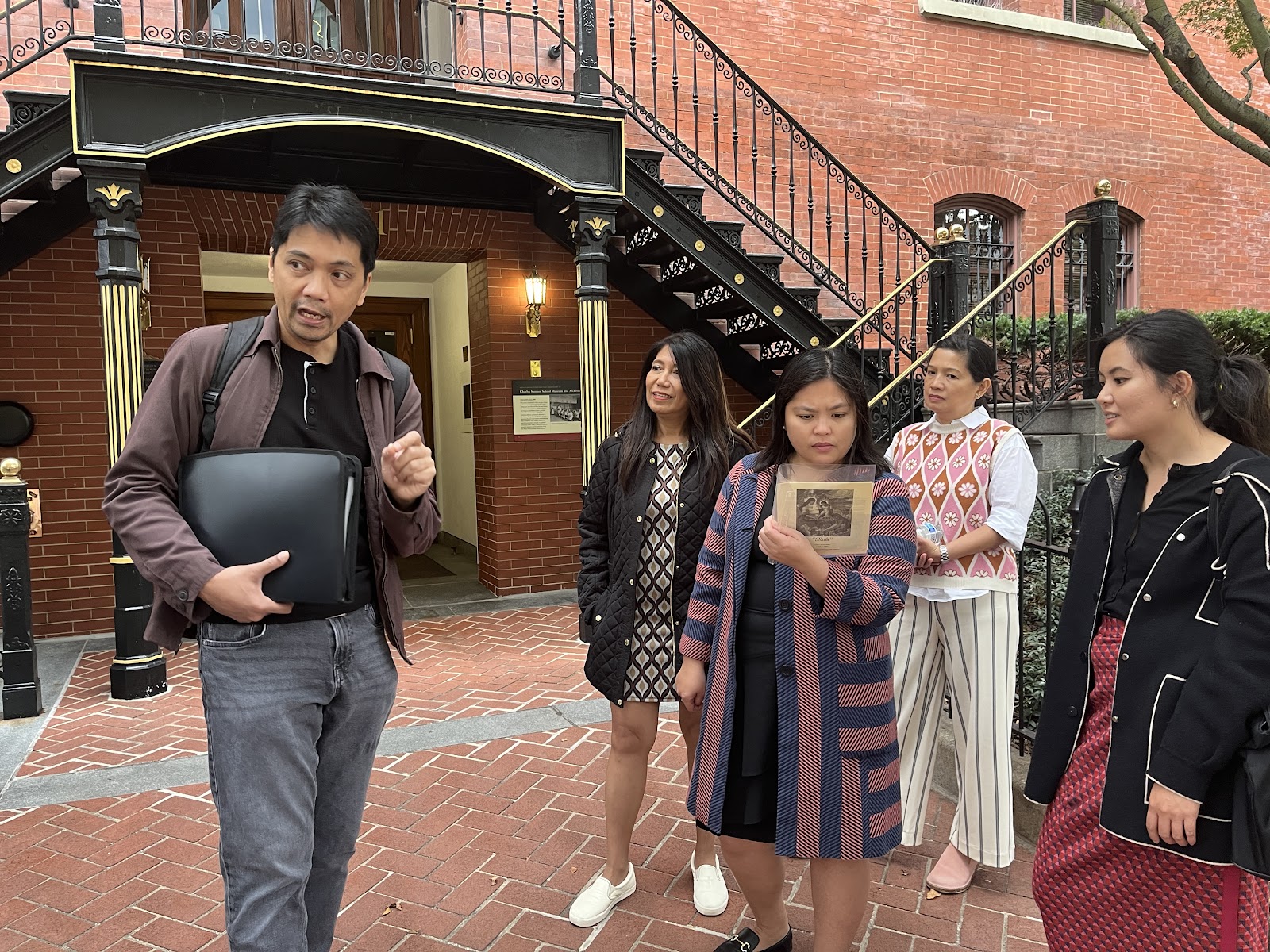 Mr. Tiongson discussing the life and works of Mr. Galo Ocampo in front of the Charles Sumner School.