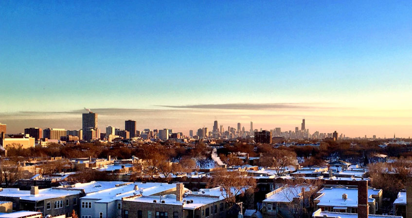 Sunset view of the Chicago skyline seen from a rooftop in the Andersonville neighborhood of Chicago.