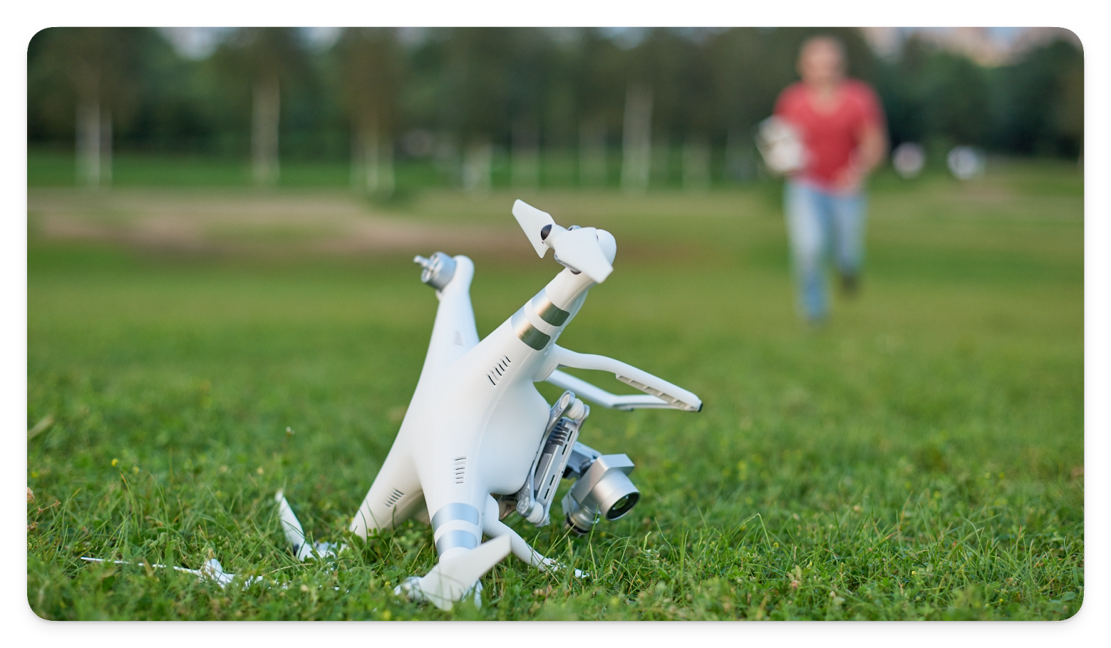 A crashed drone in a field.