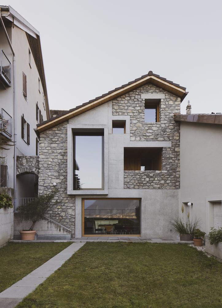 Small Stone House with Plywood Wall Cladding
