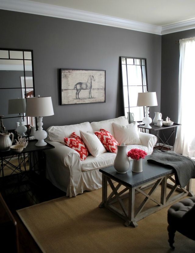 red cushions and flowers in a grey and white themed living room