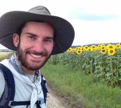 Andrew Dierkes stops to admire the flowers along a country road in central Europe.